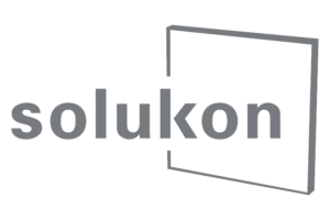 The image shows the word solukon in gray lowercase letters, with a thin gray square outline partially visible to the right of the text on a light gray background.